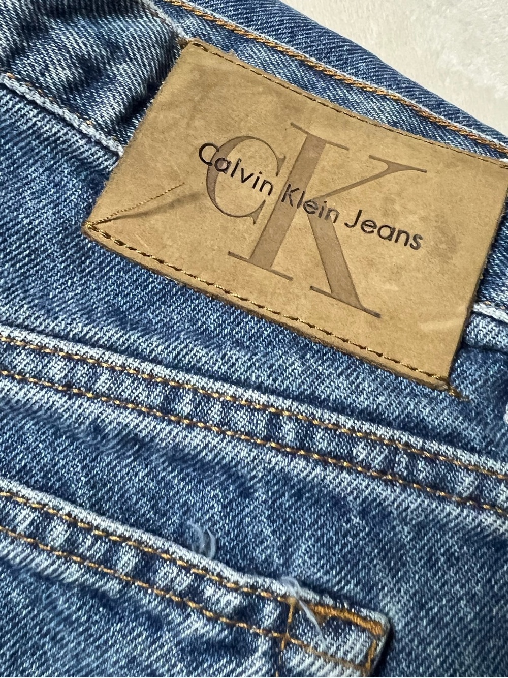 Calvin Klein Men’s Straight-Leg Medium Blue Jeans with Leather Patch